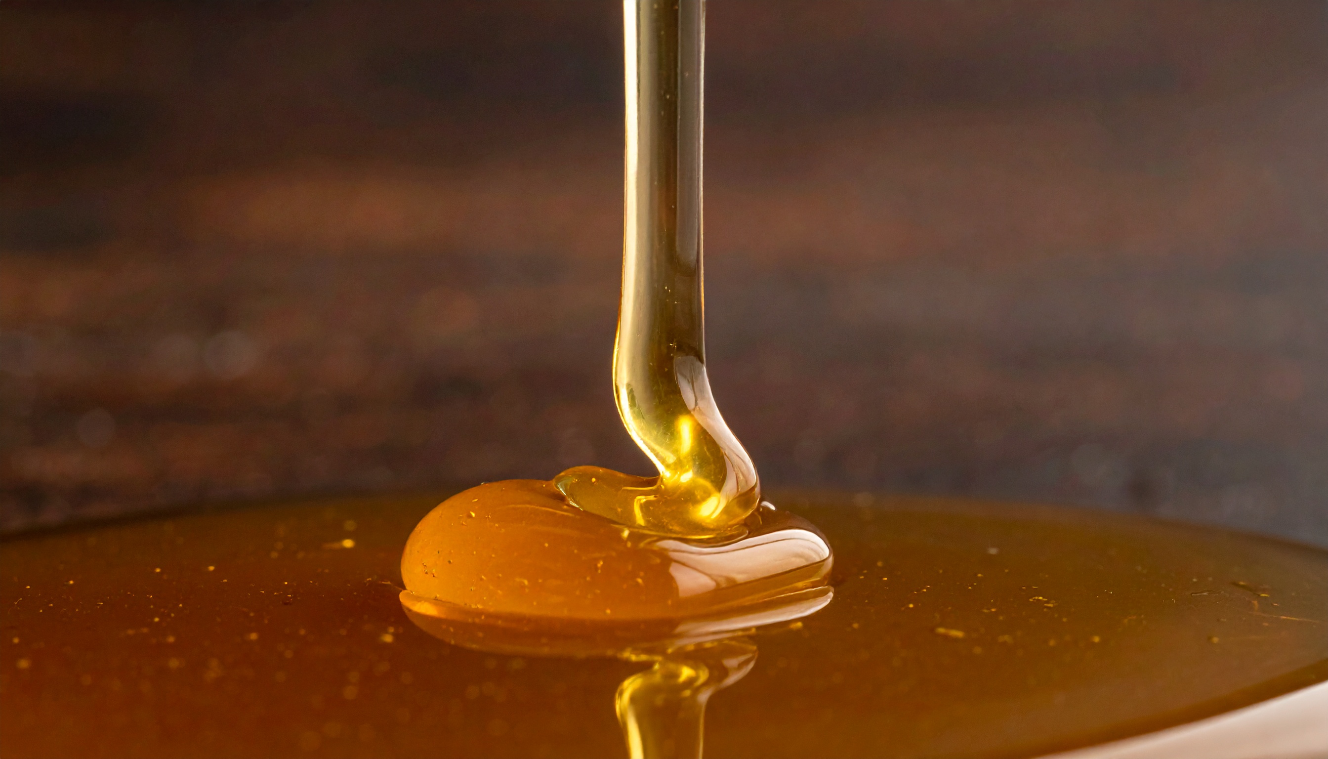 close up of organic tapioca syrup being poured in a thin stream  viscous and gol - Steve's Goods