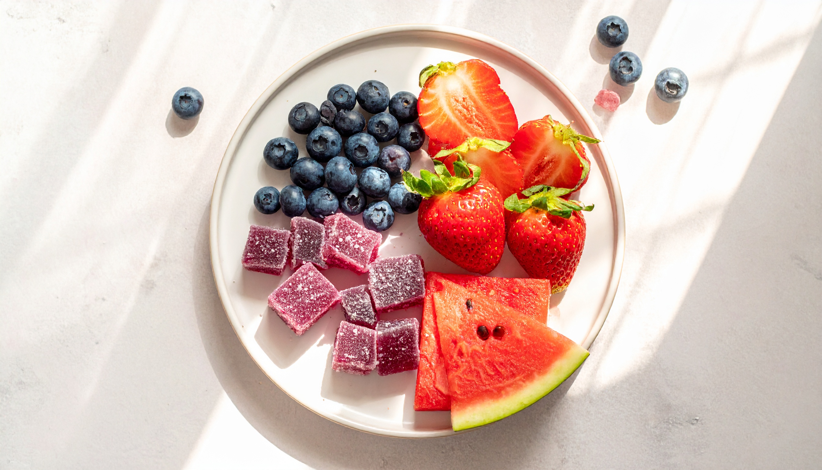 fresh blueberries strawberries and watermelon arranged in sections with cube shaped - Steve's Goods CBD